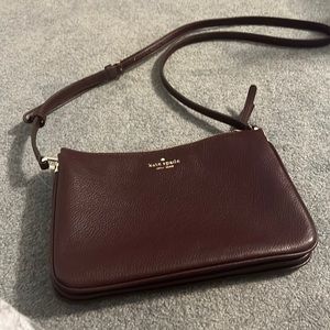 kate spade triple gusset crossbody bag. Color chocolate cherry. NWT